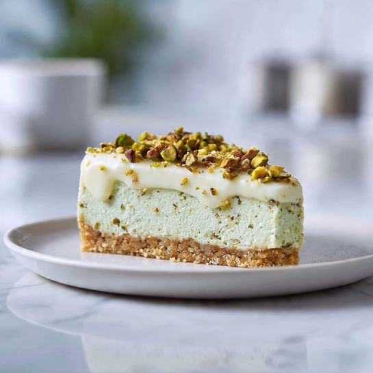 Creamy Pistachio Cheesecake with White Chocolate Topping – Bakery Style 4 Creamy Pistachio Cheesecake with White Chocolate Topping – Bakery Style - Recipe Image