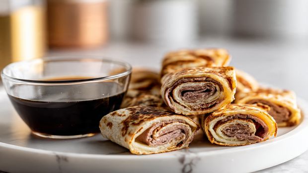 Baked French Dip Tortilla Roll Ups with Au Jus